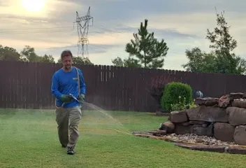 spraying lawn for weeds